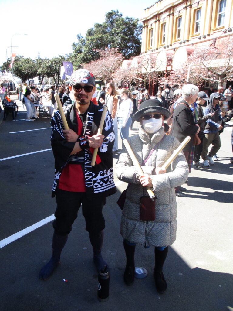 (Japan Society Vice President Kinuko Iko, posing with Kodama Drummer IPU student)
